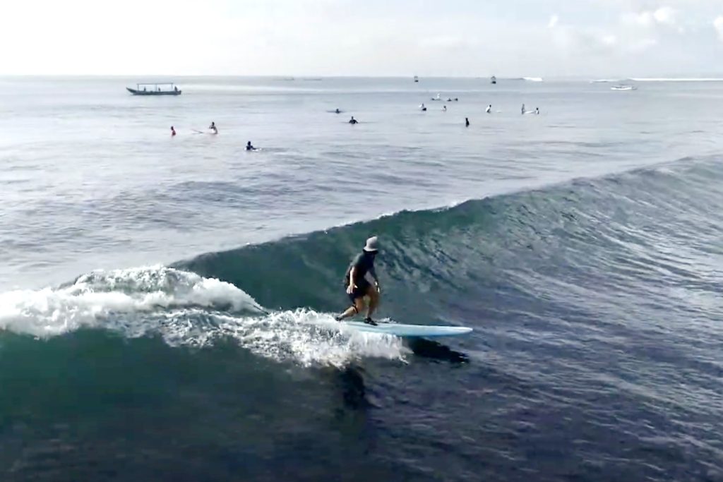 Surfer at Baby Reef Sanur